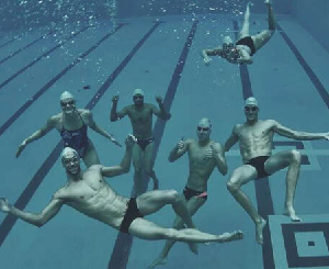 Swimmers goofing off underwater